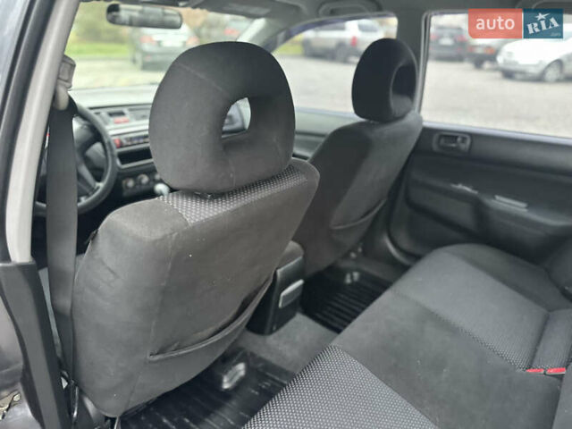 Сірий Міцубісі Lancer, об'ємом двигуна 1.6 л та пробігом 177 тис. км за 2800 $, фото 27 на Automoto.ua