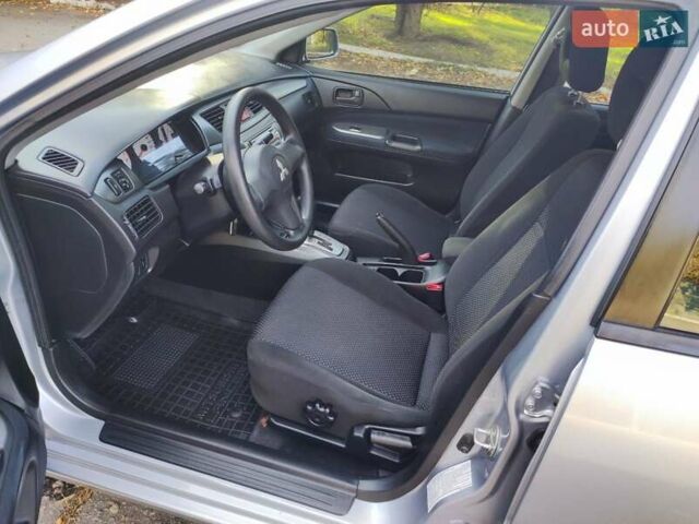 Сірий Міцубісі Lancer, об'ємом двигуна 1.58 л та пробігом 122 тис. км за 6300 $, фото 30 на Automoto.ua