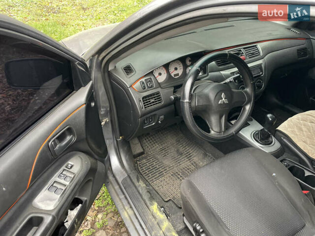 Сірий Міцубісі Lancer, об'ємом двигуна 1.58 л та пробігом 290 тис. км за 3500 $, фото 3 на Automoto.ua