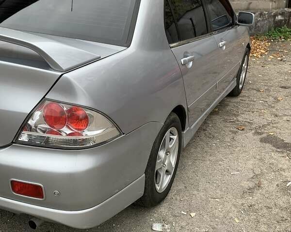 Серый Мицубиси Лансер, объемом двигателя 1.6 л и пробегом 196 тыс. км за 3800 $, фото 1 на Automoto.ua