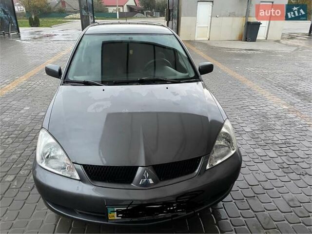 Сірий Міцубісі Lancer, об'ємом двигуна 1.6 л та пробігом 330 тис. км за 3500 $, фото 21 на Automoto.ua