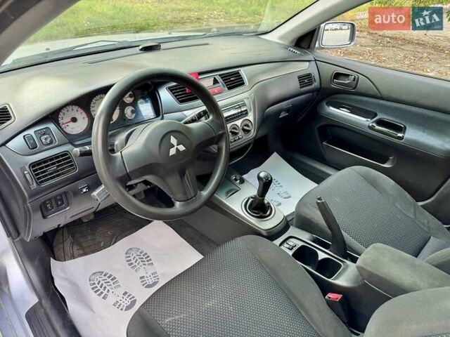Сірий Міцубісі Lancer, об'ємом двигуна 1.58 л та пробігом 138 тис. км за 4990 $, фото 23 на Automoto.ua