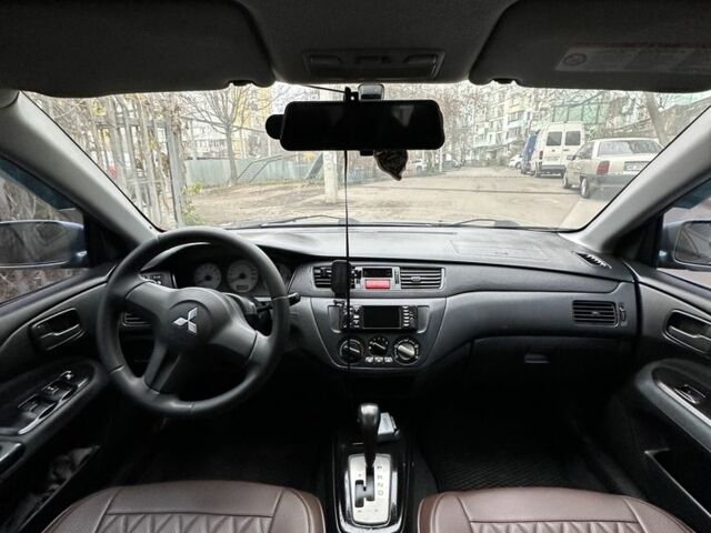 Серый Мицубиси Лансер, объемом двигателя 1.6 л и пробегом 238 тыс. км за 4300 $, фото 2 на Automoto.ua