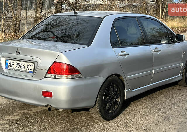Серый Мицубиси Лансер, объемом двигателя 1.58 л и пробегом 290 тыс. км за 3750 $, фото 3 на Automoto.ua