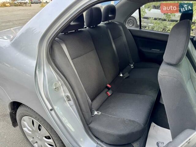 Сірий Міцубісі Lancer, об'ємом двигуна 1.58 л та пробігом 138 тис. км за 4990 $, фото 19 на Automoto.ua