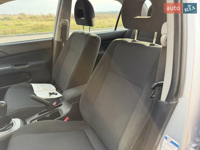 Серый Мицубиси Лансер, объемом двигателя 1.3 л и пробегом 160 тыс. км за 5555 $, фото 36 на Automoto.ua