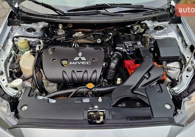 Серый Мицубиси Лансер, объемом двигателя 2 л и пробегом 213 тыс. км за 6550 $, фото 26 на Automoto.ua