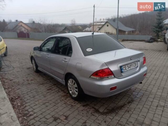 Серый Мицубиси Лансер, объемом двигателя 1.58 л и пробегом 175 тыс. км за 4000 $, фото 11 на Automoto.ua