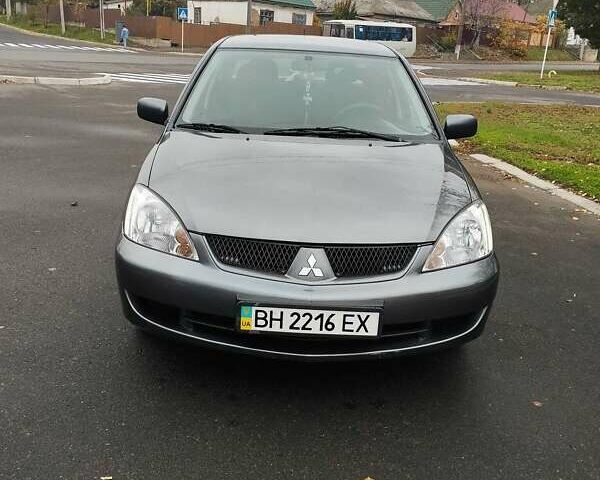 Серый Мицубиси Лансер, объемом двигателя 1.6 л и пробегом 181 тыс. км за 4500 $, фото 2 на Automoto.ua