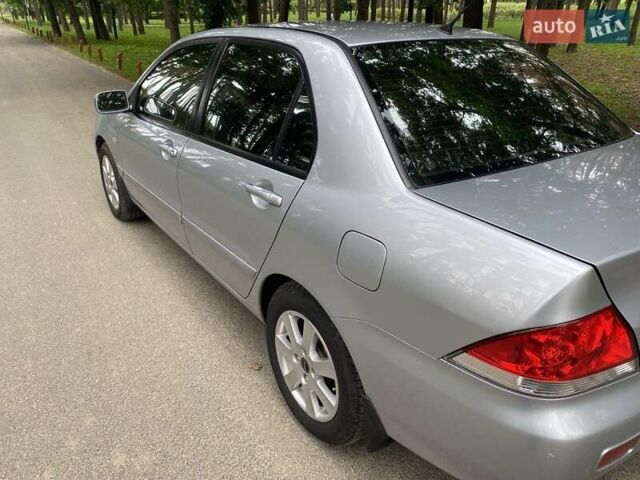 Серый Мицубиси Лансер, объемом двигателя 1.59 л и пробегом 220 тыс. км за 6500 $, фото 4 на Automoto.ua