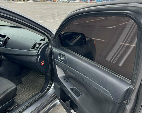 Сірий Міцубісі Lancer, об'ємом двигуна 2 л та пробігом 300 тис. км за 6299 $, фото 14 на Automoto.ua