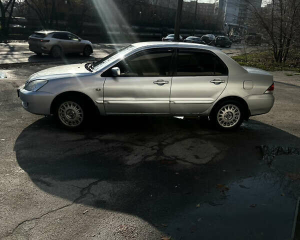 Сірий Міцубісі Lancer, об'ємом двигуна 1.6 л та пробігом 249 тис. км за 5100 $, фото 1 на Automoto.ua