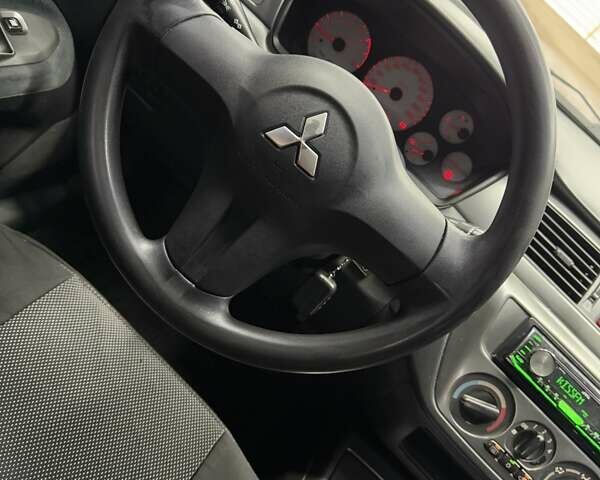 Серый Мицубиси Лансер, объемом двигателя 1.58 л и пробегом 271 тыс. км за 4200 $, фото 26 на Automoto.ua