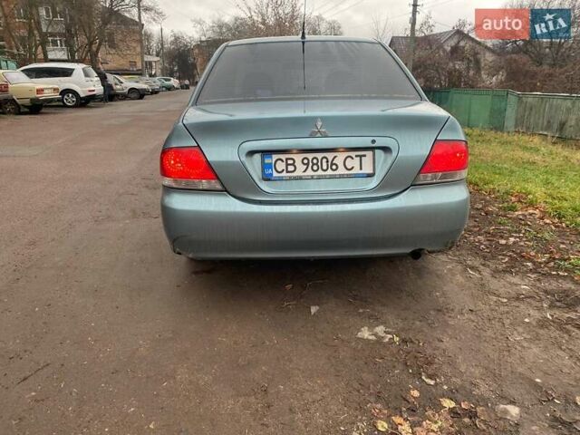 Серый Мицубиси Лансер, объемом двигателя 1.6 л и пробегом 218 тыс. км за 5000 $, фото 6 на Automoto.ua