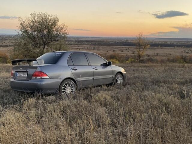 Серый Мицубиси Лансер, объемом двигателя 1.6 л и пробегом 250 тыс. км за 3999 $, фото 20 на Automoto.ua