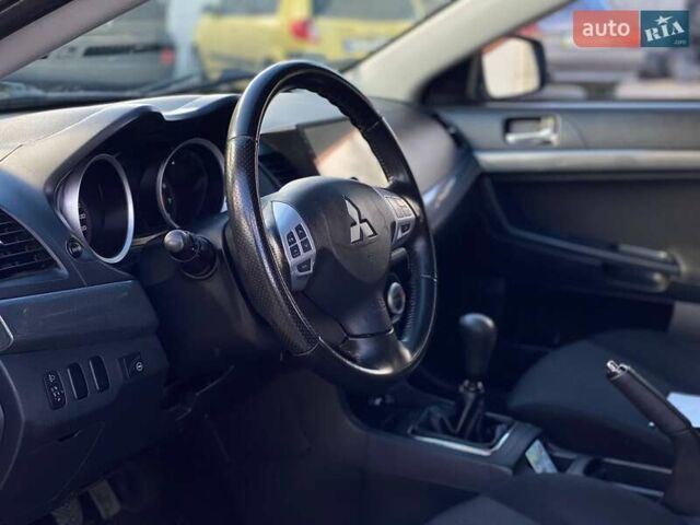 Серый Мицубиси Лансер, объемом двигателя 2 л и пробегом 150 тыс. км за 6100 $, фото 11 на Automoto.ua