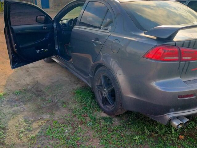 Серый Мицубиси Лансер, объемом двигателя 2 л и пробегом 351 тыс. км за 7000 $, фото 3 на Automoto.ua