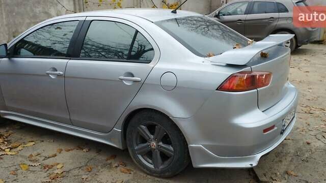 Серый Мицубиси Лансер, объемом двигателя 2 л и пробегом 305 тыс. км за 6300 $, фото 3 на Automoto.ua
