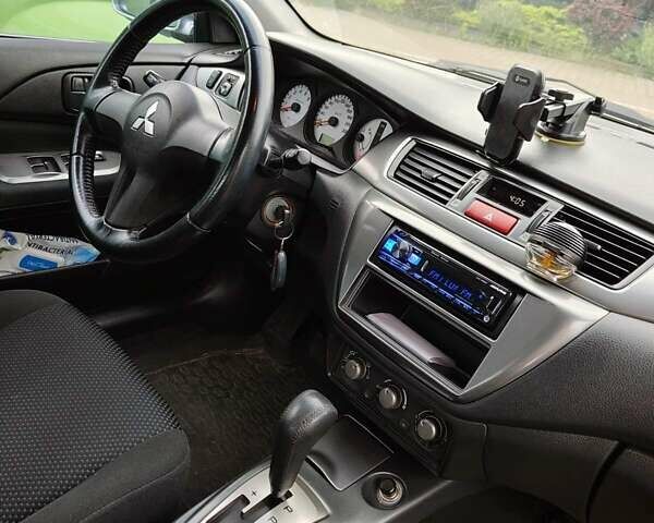 Сірий Міцубісі Lancer, об'ємом двигуна 1.58 л та пробігом 168 тис. км за 5700 $, фото 5 на Automoto.ua
