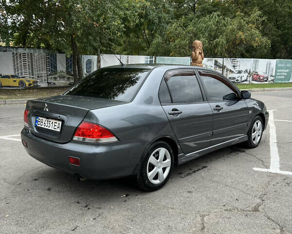 Сірий Міцубісі Lancer, об'ємом двигуна 1.58 л та пробігом 176 тис. км за 4700 $, фото 2 на Automoto.ua