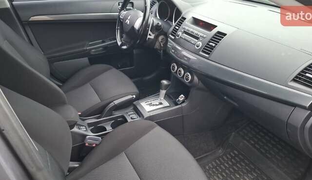 Серый Мицубиси Лансер, объемом двигателя 2 л и пробегом 189 тыс. км за 6800 $, фото 6 на Automoto.ua