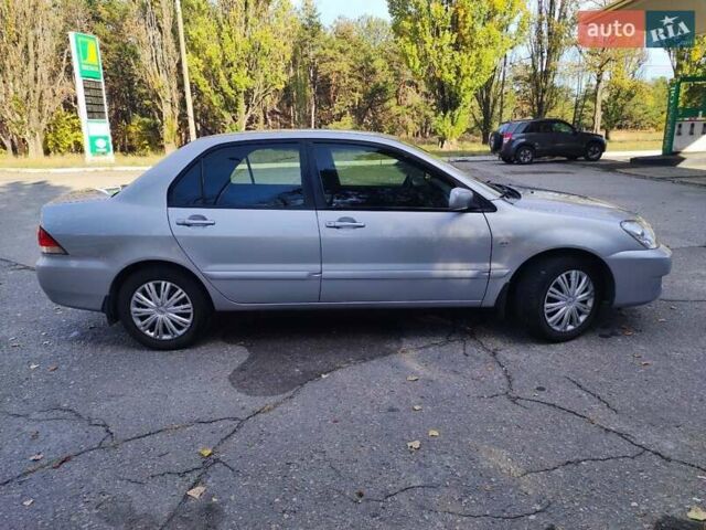 Сірий Міцубісі Lancer, об'ємом двигуна 1.58 л та пробігом 122 тис. км за 6300 $, фото 21 на Automoto.ua