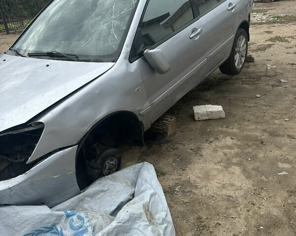 Сірий Міцубісі Lancer, об'ємом двигуна 1.58 л та пробігом 210 тис. км за 1300 $, фото 4 на Automoto.ua