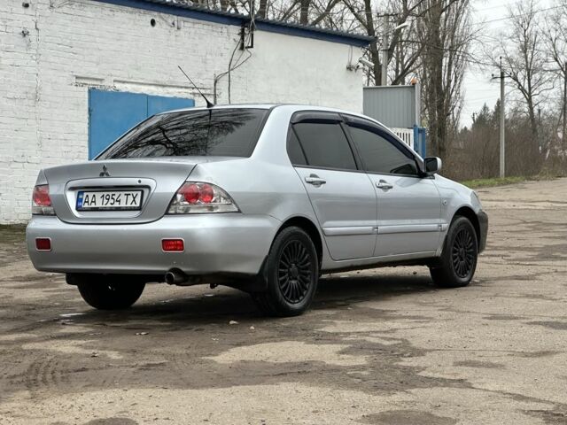 Серый Мицубиси Лансер, объемом двигателя 1.6 л и пробегом 298 тыс. км за 3600 $, фото 4 на Automoto.ua