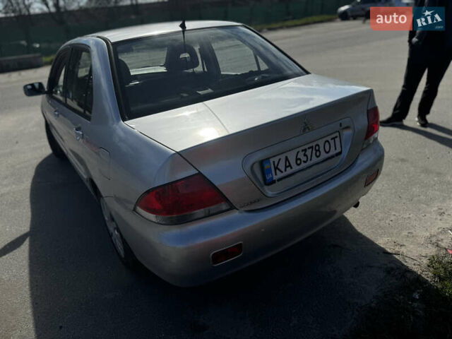 Серый Мицубиси Лансер, объемом двигателя 1.58 л и пробегом 261 тыс. км за 4500 $, фото 11 на Automoto.ua