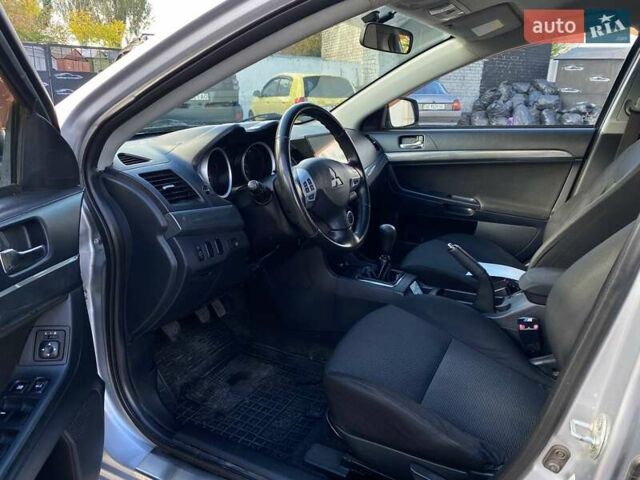 Серый Мицубиси Лансер, объемом двигателя 2 л и пробегом 150 тыс. км за 6100 $, фото 10 на Automoto.ua
