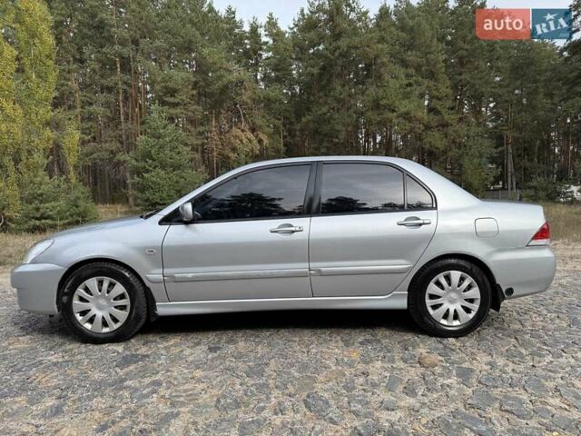 Серый Мицубиси Лансер, объемом двигателя 1.6 л и пробегом 200 тыс. км за 4400 $, фото 13 на Automoto.ua