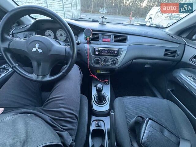 Серый Мицубиси Лансер, объемом двигателя 1.6 л и пробегом 256 тыс. км за 4500 $, фото 6 на Automoto.ua