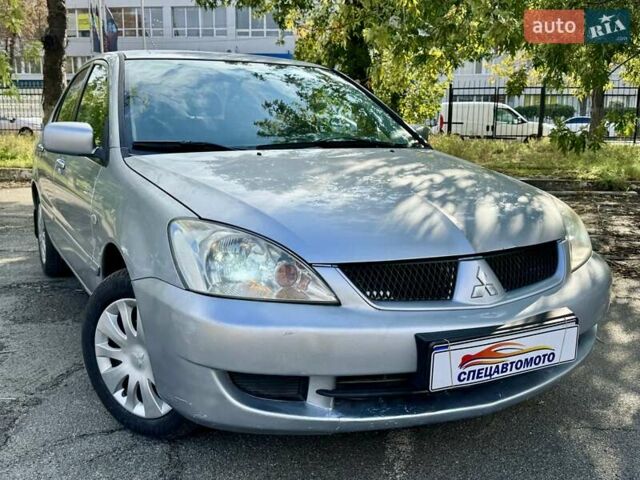 Сірий Міцубісі Lancer, об'ємом двигуна 1.58 л та пробігом 138 тис. км за 4990 $, фото 2 на Automoto.ua
