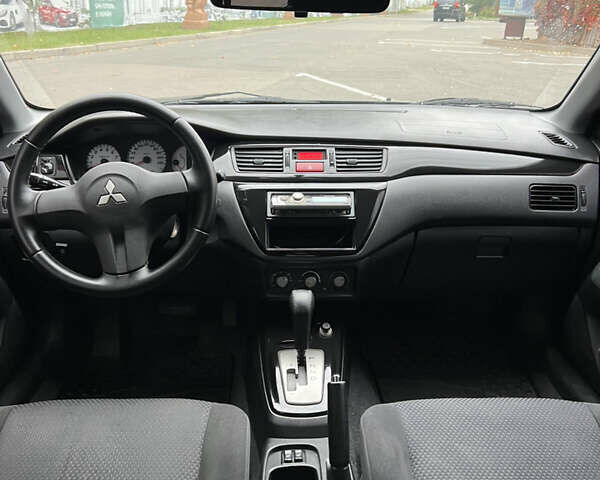 Сірий Міцубісі Lancer, об'ємом двигуна 1.58 л та пробігом 176 тис. км за 4700 $, фото 8 на Automoto.ua