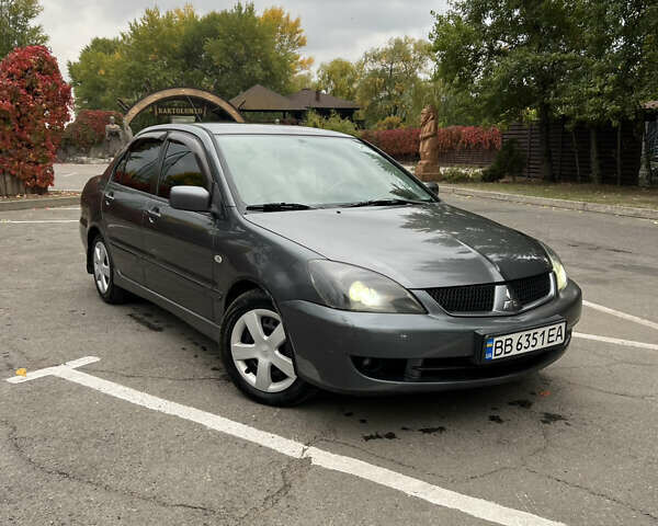 Сірий Міцубісі Lancer, об'ємом двигуна 1.58 л та пробігом 176 тис. км за 4700 $, фото 5 на Automoto.ua