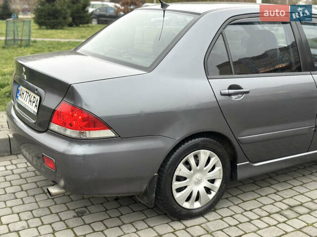 Сірий Міцубісі Lancer, об'ємом двигуна 1.6 л та пробігом 177 тис. км за 2800 $, фото 8 на Automoto.ua
