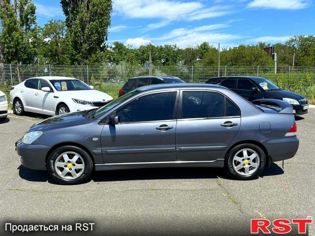 Сірий Міцубісі Lancer, об'ємом двигуна 1.6 л та пробігом 130 тис. км за 3999 $, фото 7 на Automoto.ua