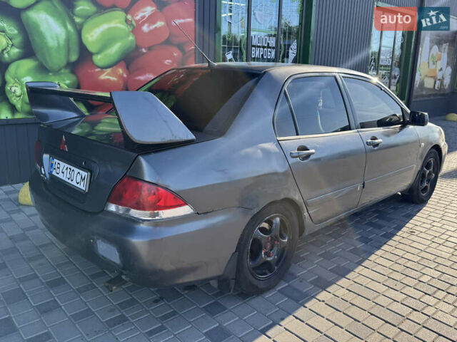 Сірий Міцубісі Lancer, об'ємом двигуна 1.58 л та пробігом 341 тис. км за 2200 $, фото 6 на Automoto.ua