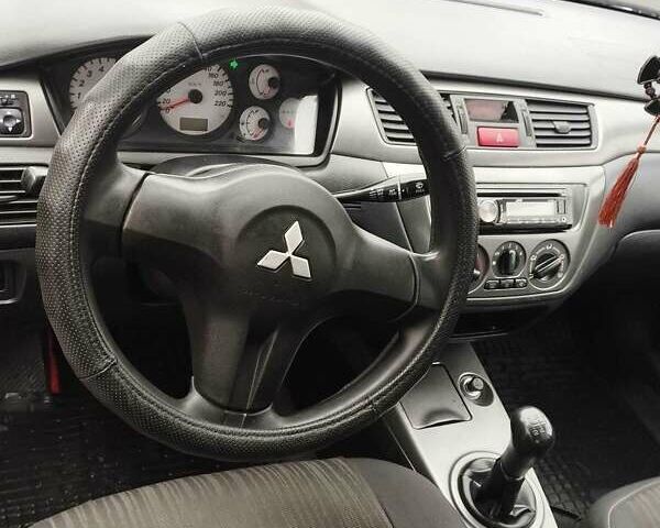 Серый Мицубиси Лансер, объемом двигателя 1.6 л и пробегом 181 тыс. км за 4500 $, фото 9 на Automoto.ua