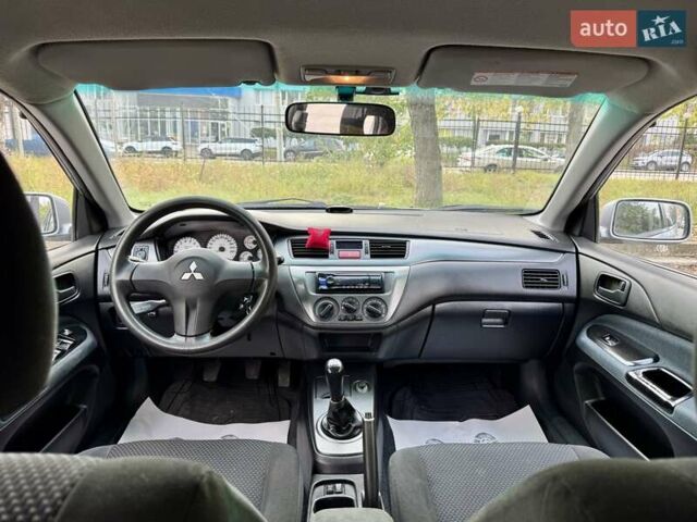 Сірий Міцубісі Lancer, об'ємом двигуна 1.58 л та пробігом 138 тис. км за 4990 $, фото 20 на Automoto.ua
