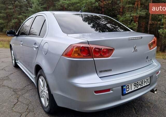 Серый Мицубиси Лансер, объемом двигателя 2 л и пробегом 213 тыс. км за 6550 $, фото 9 на Automoto.ua