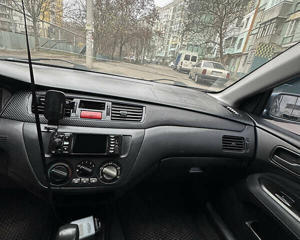 Серый Мицубиси Лансер, объемом двигателя 1.6 л и пробегом 238 тыс. км за 4400 $, фото 12 на Automoto.ua