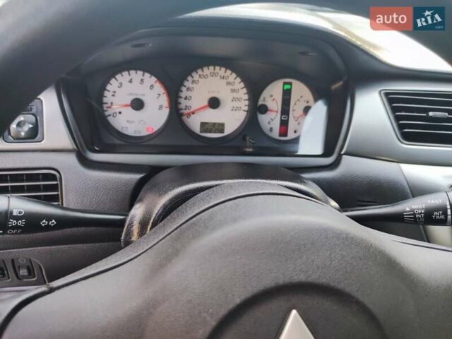 Сірий Міцубісі Lancer, об'ємом двигуна 1.58 л та пробігом 122 тис. км за 6300 $, фото 29 на Automoto.ua