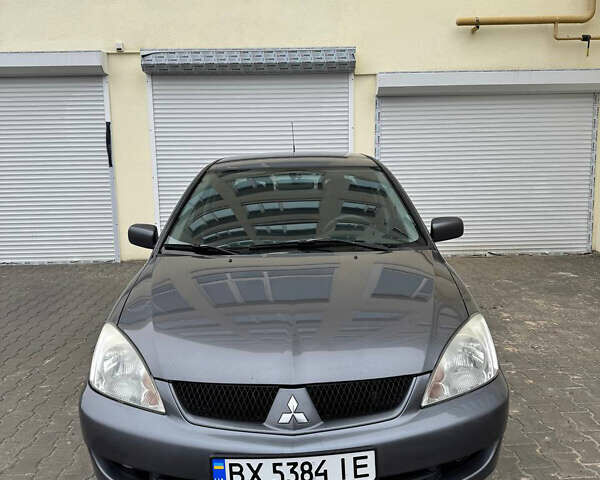 Серый Мицубиси Лансер, объемом двигателя 1.58 л и пробегом 187 тыс. км за 4800 $, фото 1 на Automoto.ua