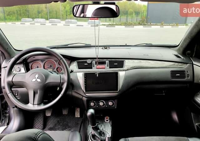 Серый Мицубиси Лансер, объемом двигателя 1.6 л и пробегом 130 тыс. км за 7500 $, фото 8 на Automoto.ua
