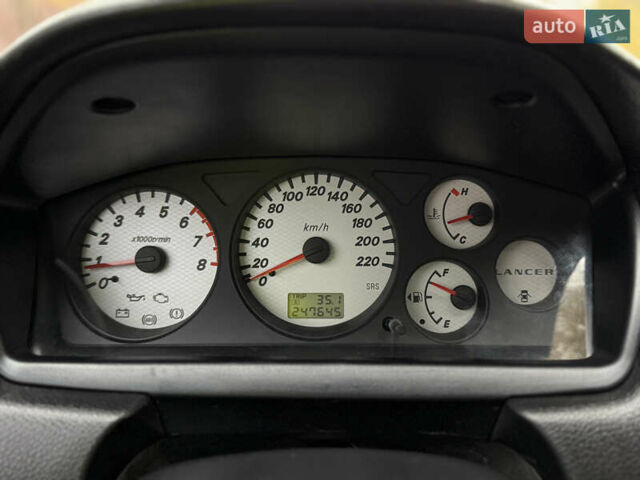 Сірий Міцубісі Lancer, об'ємом двигуна 1.58 л та пробігом 247 тис. км за 4900 $, фото 22 на Automoto.ua