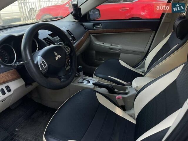 Сірий Міцубісі Lancer, об'ємом двигуна 2 л та пробігом 203 тис. км за 6999 $, фото 12 на Automoto.ua