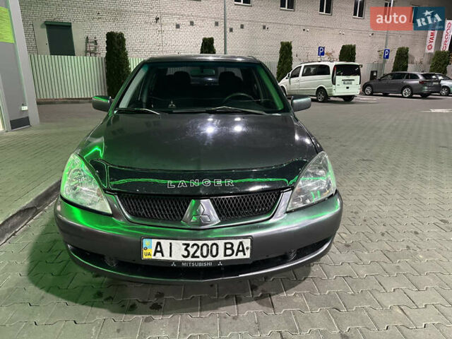Серый Мицубиси Лансер, объемом двигателя 1.6 л и пробегом 112 тыс. км за 2800 $, фото 11 на Automoto.ua