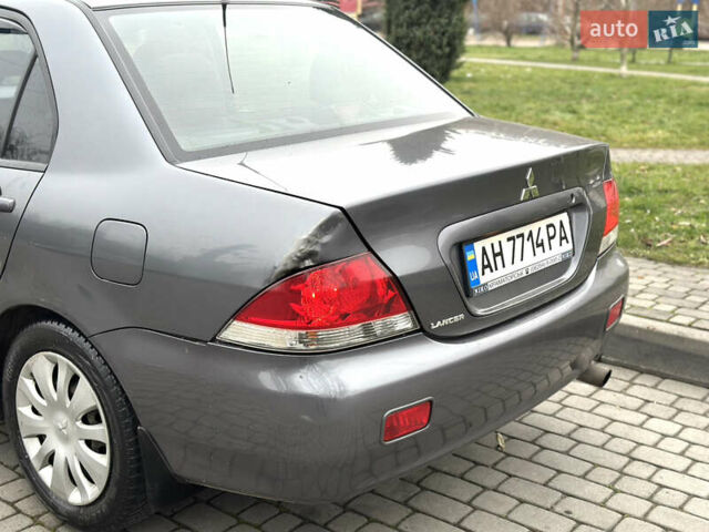 Сірий Міцубісі Lancer, об'ємом двигуна 1.6 л та пробігом 177 тис. км за 2800 $, фото 4 на Automoto.ua