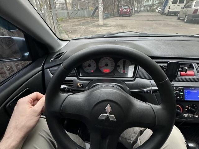 Серый Мицубиси Лансер, объемом двигателя 1.6 л и пробегом 238 тыс. км за 4300 $, фото 1 на Automoto.ua